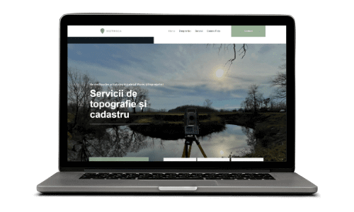 Laptop arătând servicii topografie și cadastru